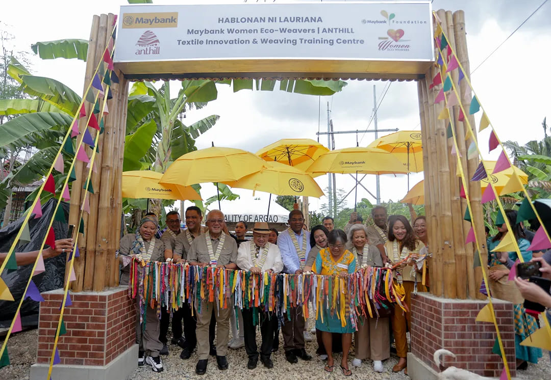 Tan Sri Dato’ Sri Ir. Zamzamzairani Mohd Isa and guests perform a ribbon-cutting ceremony at the Maybank Women Eco-Weavers ANTHILL Training Centre groundbreaking in Cebu, supporting women empowerment and cultural preservation.
